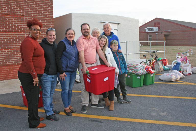 Two Couples Make Christmas Brighter for E. S. Boys and Girls Club Members